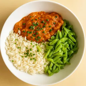 Kipfilet in tandoori met rijst en snijbonen met roomkaas