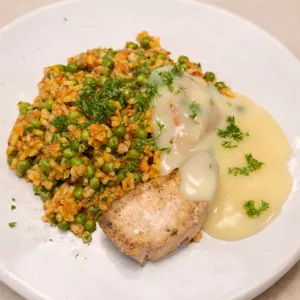 Gemarineerde witvis met citroenbotersaus en paella