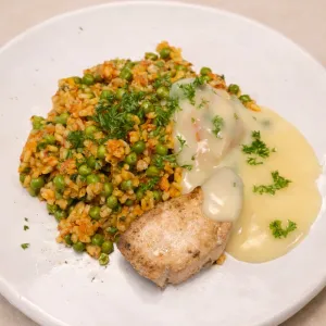 Gemarineerde witvis met citroenbotersaus en paella extra